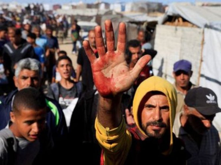 إصابة فلسطينيين قرب نقطة توزيع مساعدات بغزة